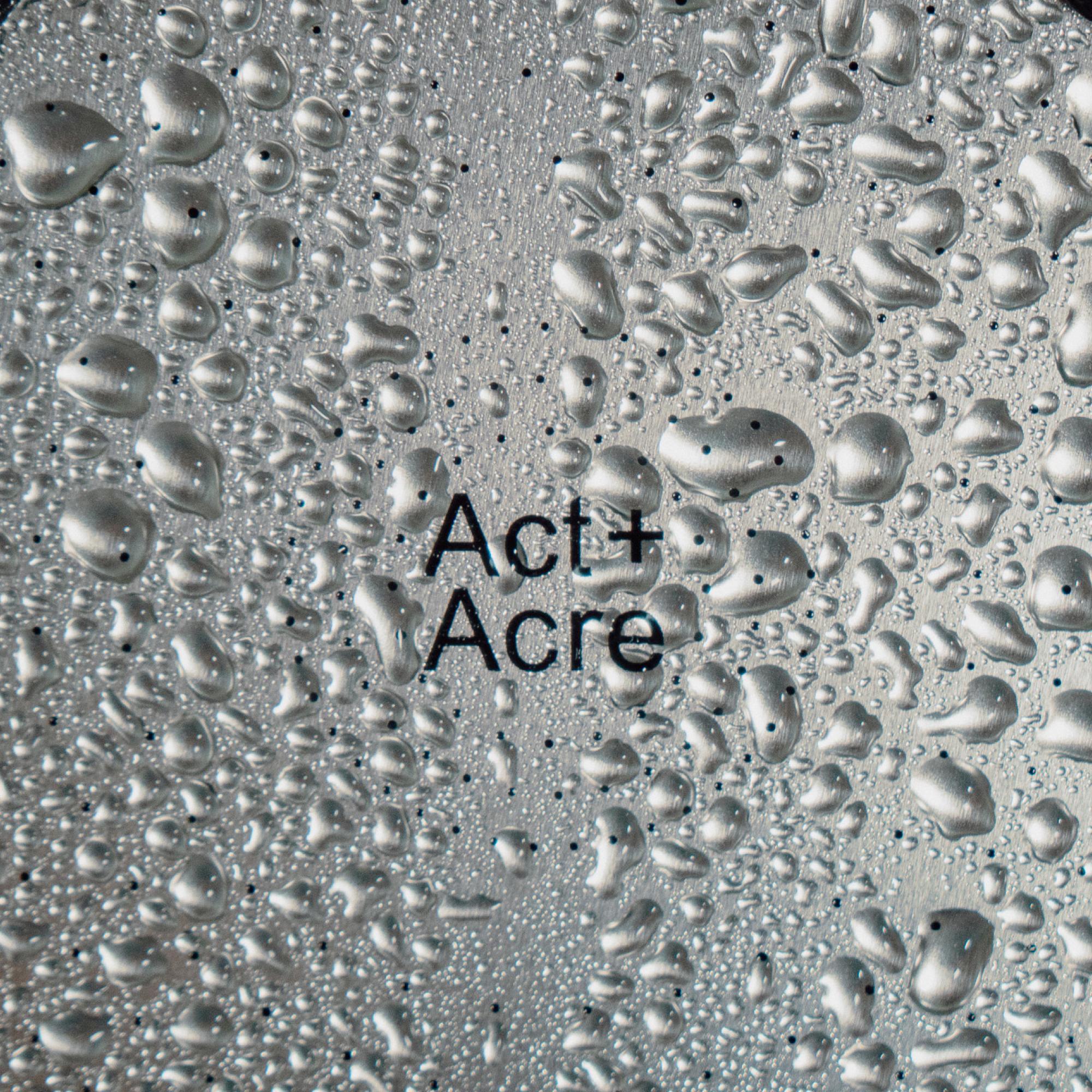 Close up of Act+Acre Showerhead Filter with water droplets